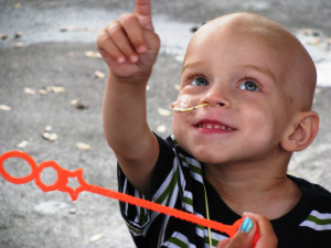JR blowing bubbles outside the House JR blowing bubbles outside the House